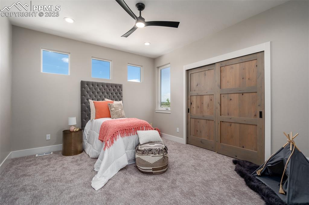 3397 Bark Tree Trail Colorado Springs, CO 80921 - Photo 23 of 50 a bed room with a bed and a window