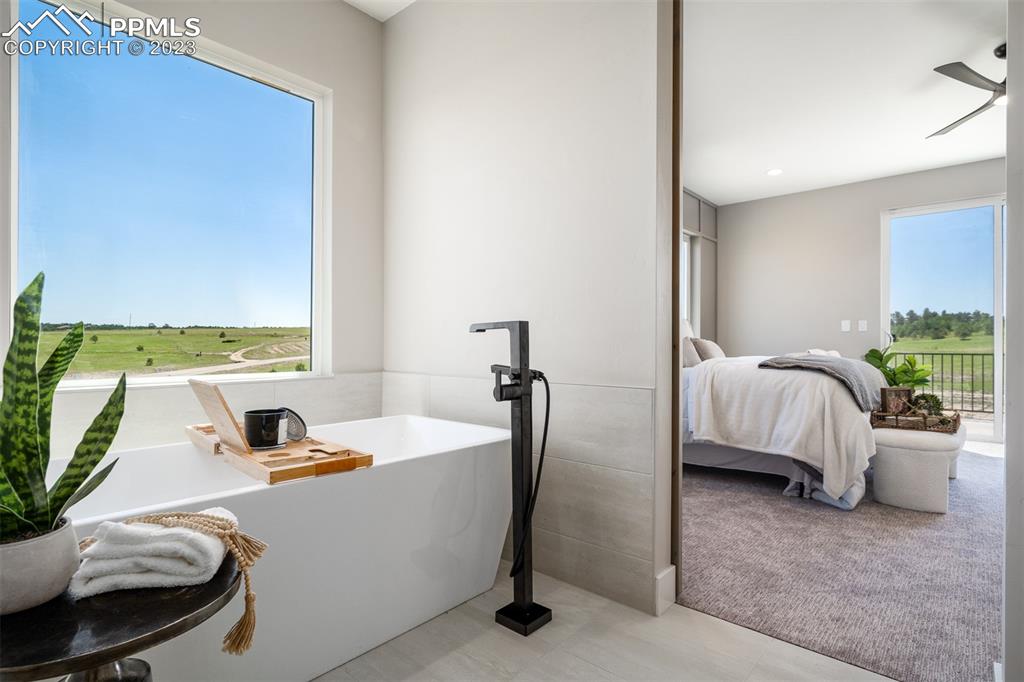 3397 Bark Tree Trail Colorado Springs, CO 80921 - Photo 30 of 50 a bathroom with a tub and a sink