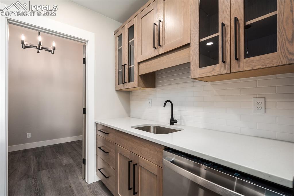 3397 Bark Tree Trail Colorado Springs, CO 80921 - Photo 33 of 50 a kitchen with stainless steel appliances a sink and cabinets