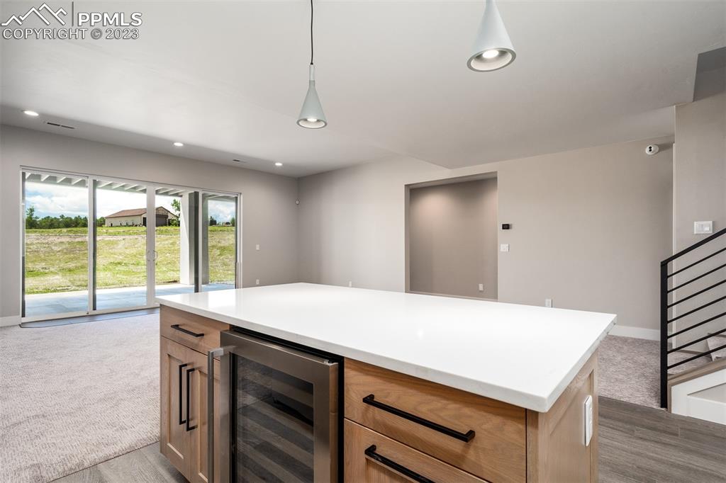 3397 Bark Tree Trail Colorado Springs, CO 80921 - Photo 35 of 50 a kitchen with a stove and a large window