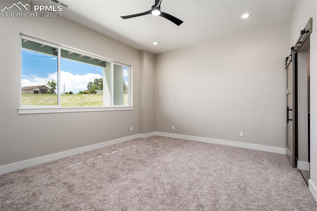3397 Bark Tree Trail Colorado Springs, CO 80921 - Photo 42 of 50 a view of an empty room with a window