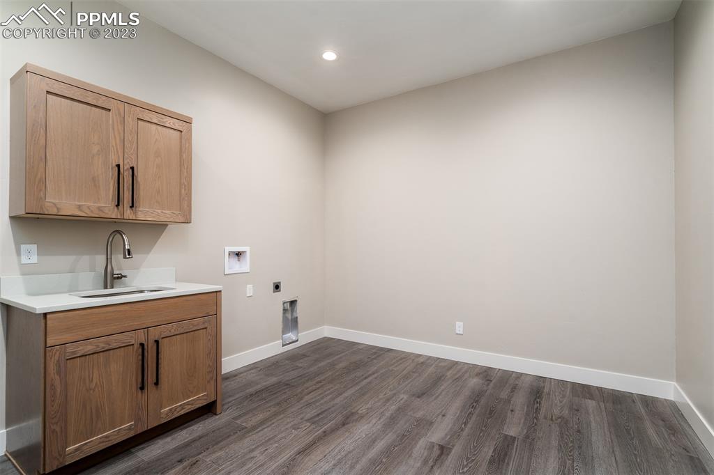 3397 Bark Tree Trail Colorado Springs, CO 80921 - Photo 45 of 50 a view of cabinets a wooden floor and a window