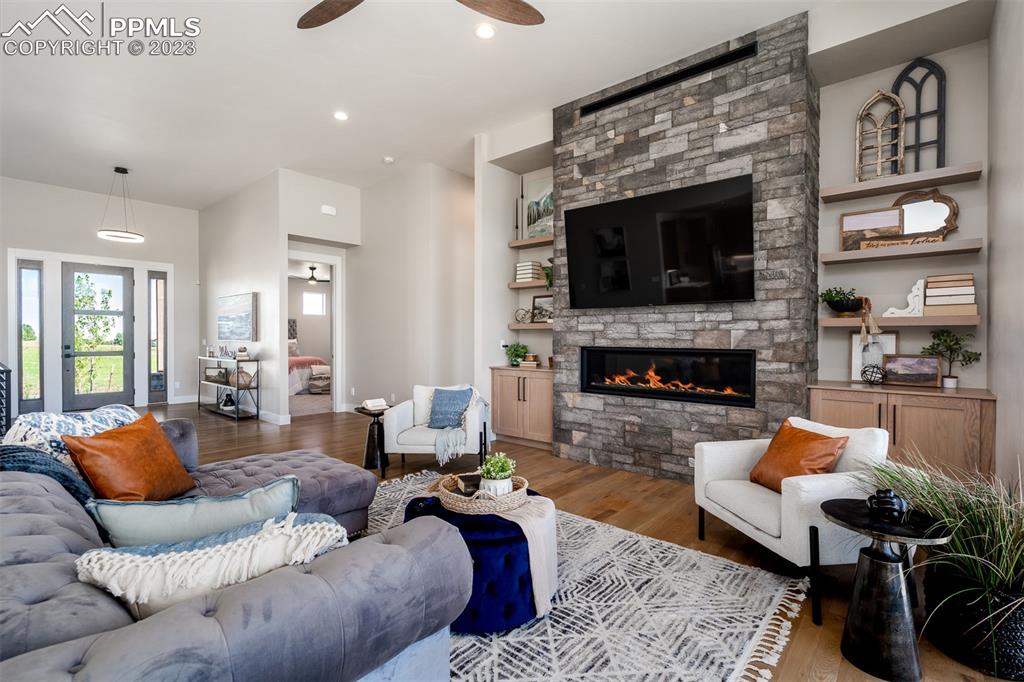 3397 Bark Tree Trail Colorado Springs, CO 80921 - Photo 9 of 50 a living room with furniture and a fireplace