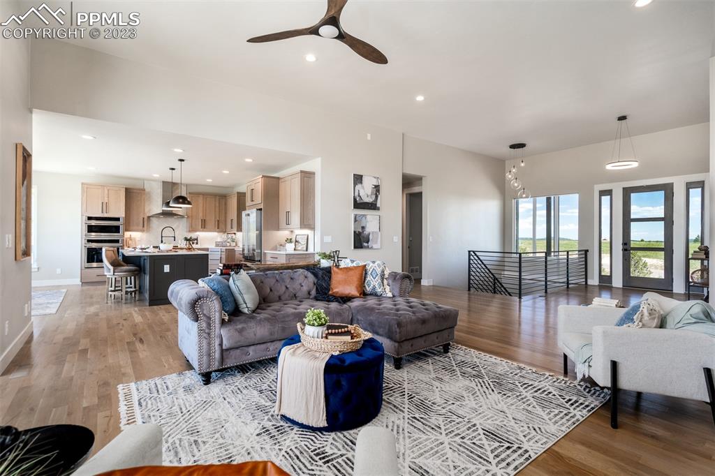 3397 Bark Tree Trail Colorado Springs, CO 80921 - Photo 10 of 50 a living room with furniture and a large window