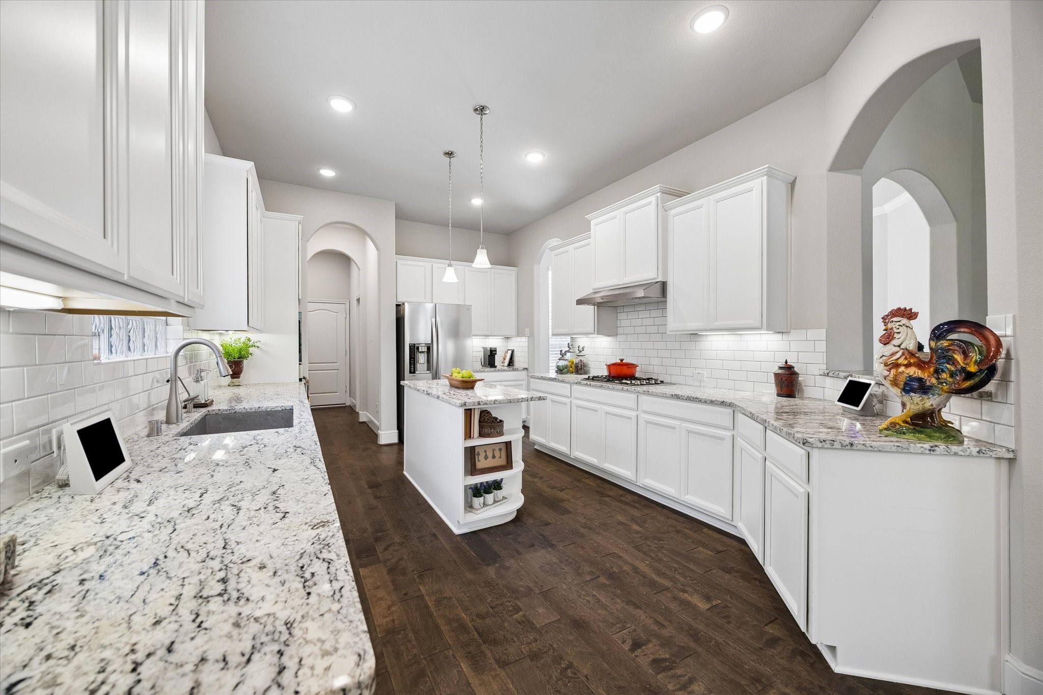 19 Peace Tree Way Tomball, TX 77375 - Photo 18 of 36 Under cabinet lighting is a feature buyers love!