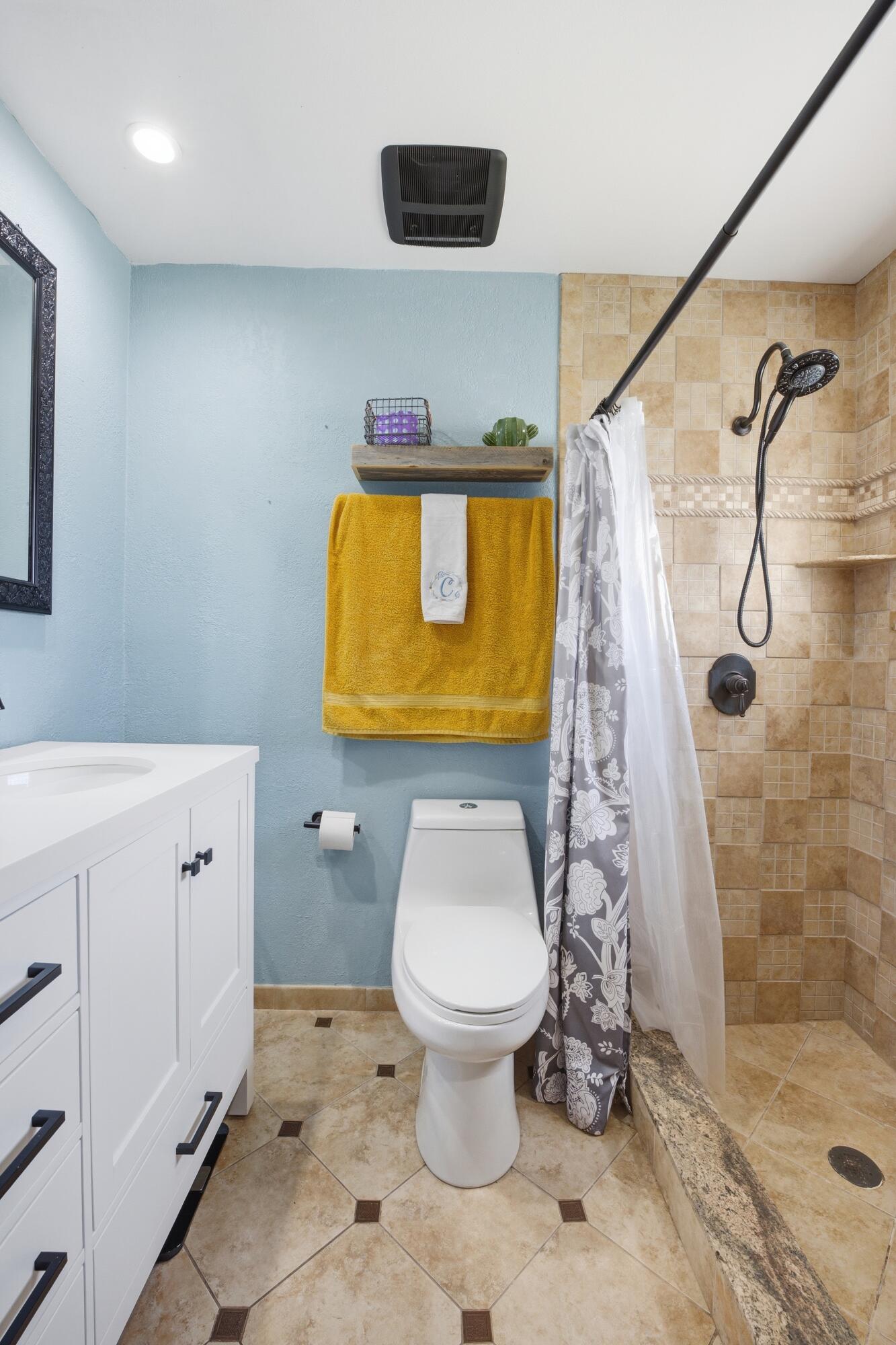 22504 Southwest 65th Avenue Boca Raton, FL 33428 - Photo 22 of 36 a bathroom with a toilet sink and shower