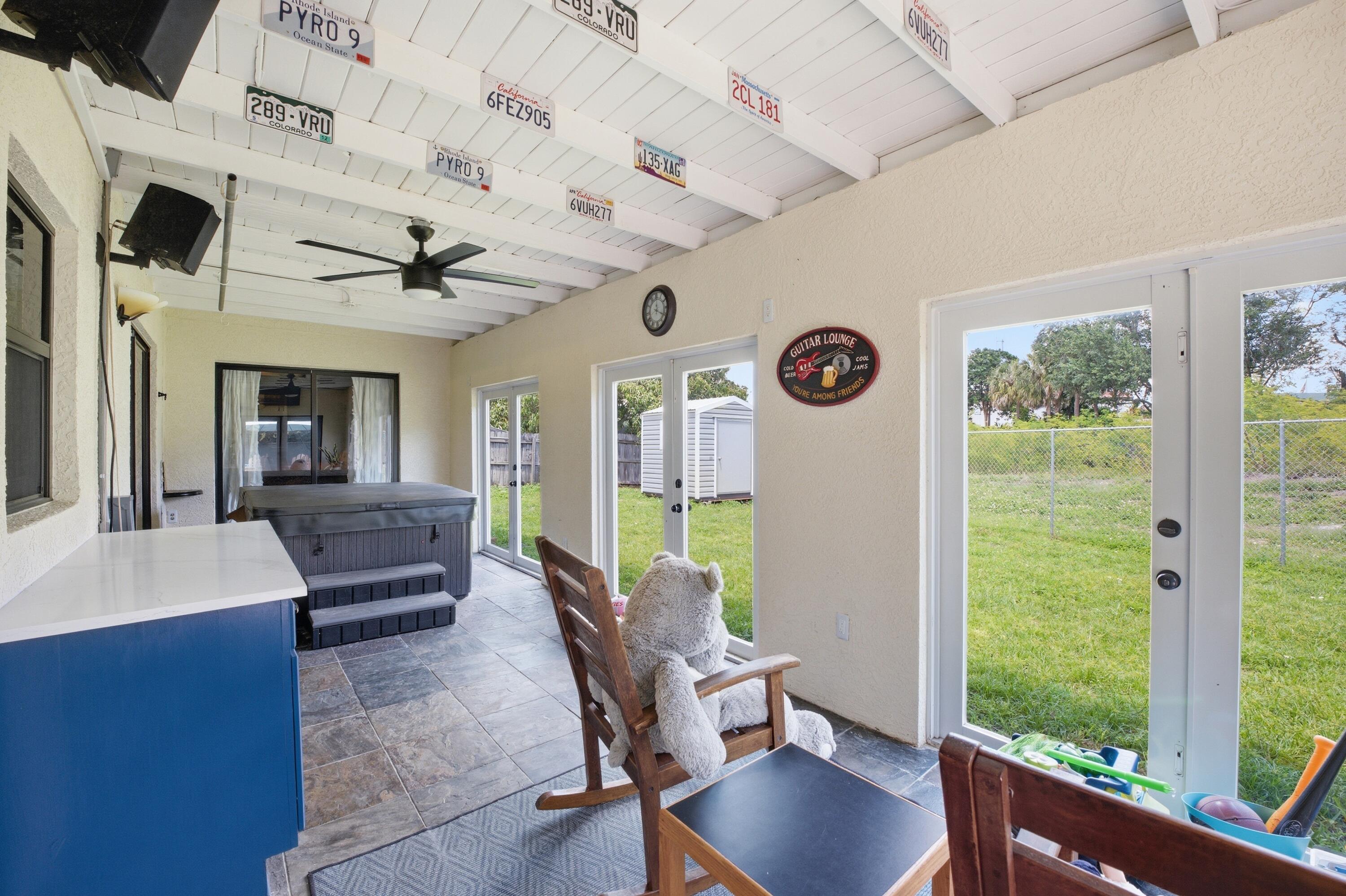 22504 Southwest 65th Avenue Boca Raton, FL 33428 - Photo 27 of 36 a living room with furniture and a large window