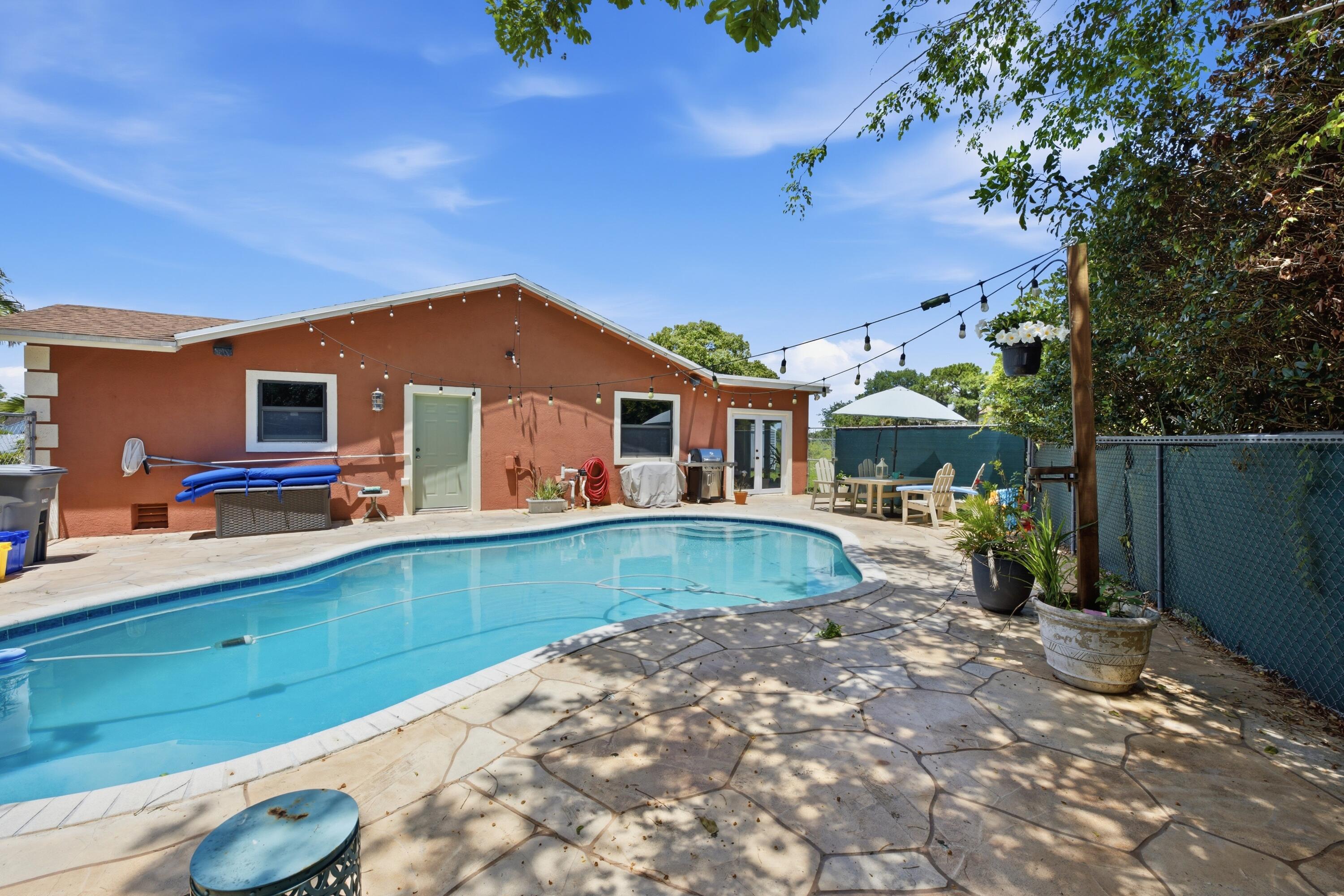 22504 Southwest 65th Avenue Boca Raton, FL 33428 - Photo 32 of 36 a view of a house with a patio