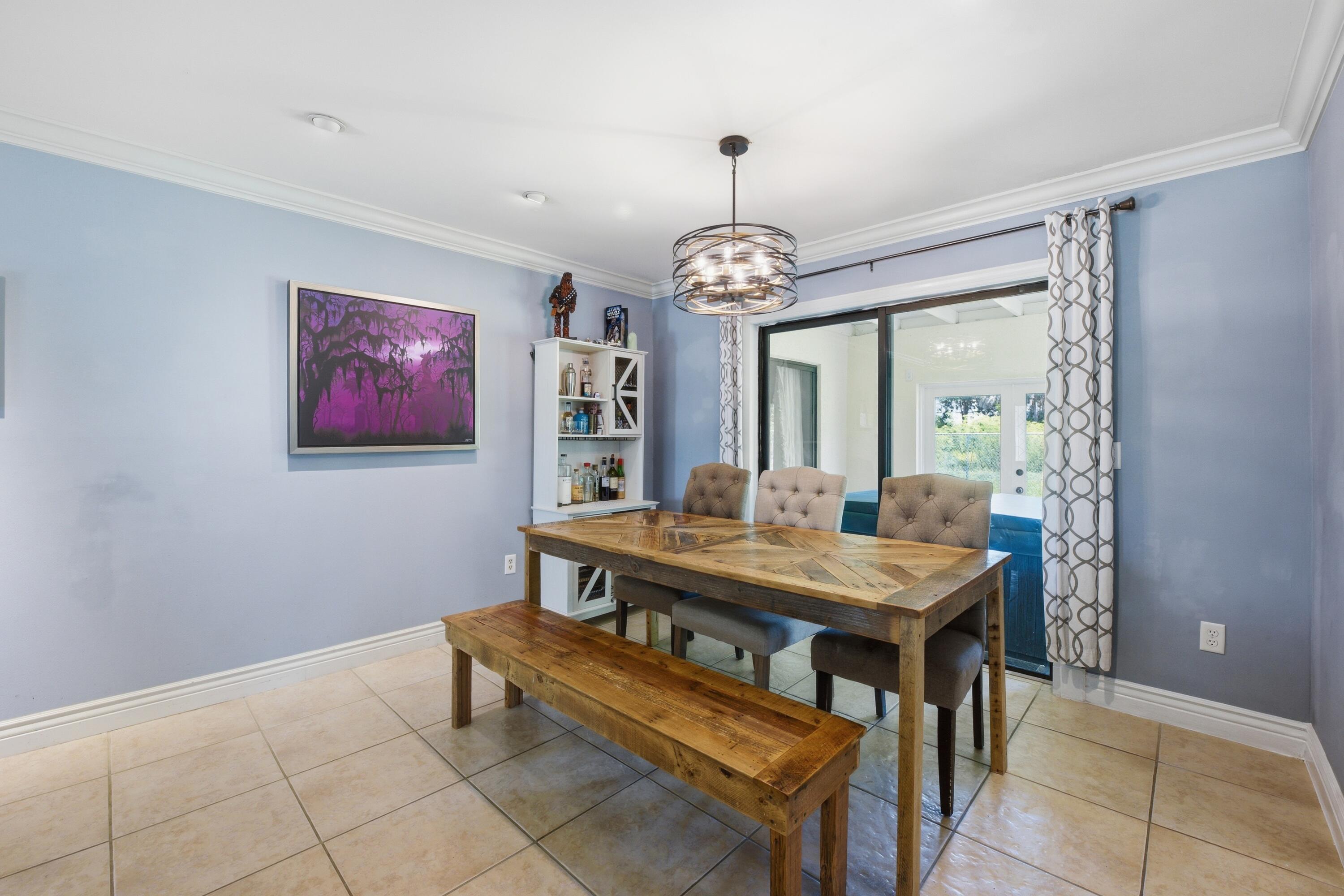 22504 Southwest 65th Avenue Boca Raton, FL 33428 - Photo 9 of 36 a view of a dining room with furniture