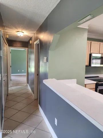 a hallway with a large mirror