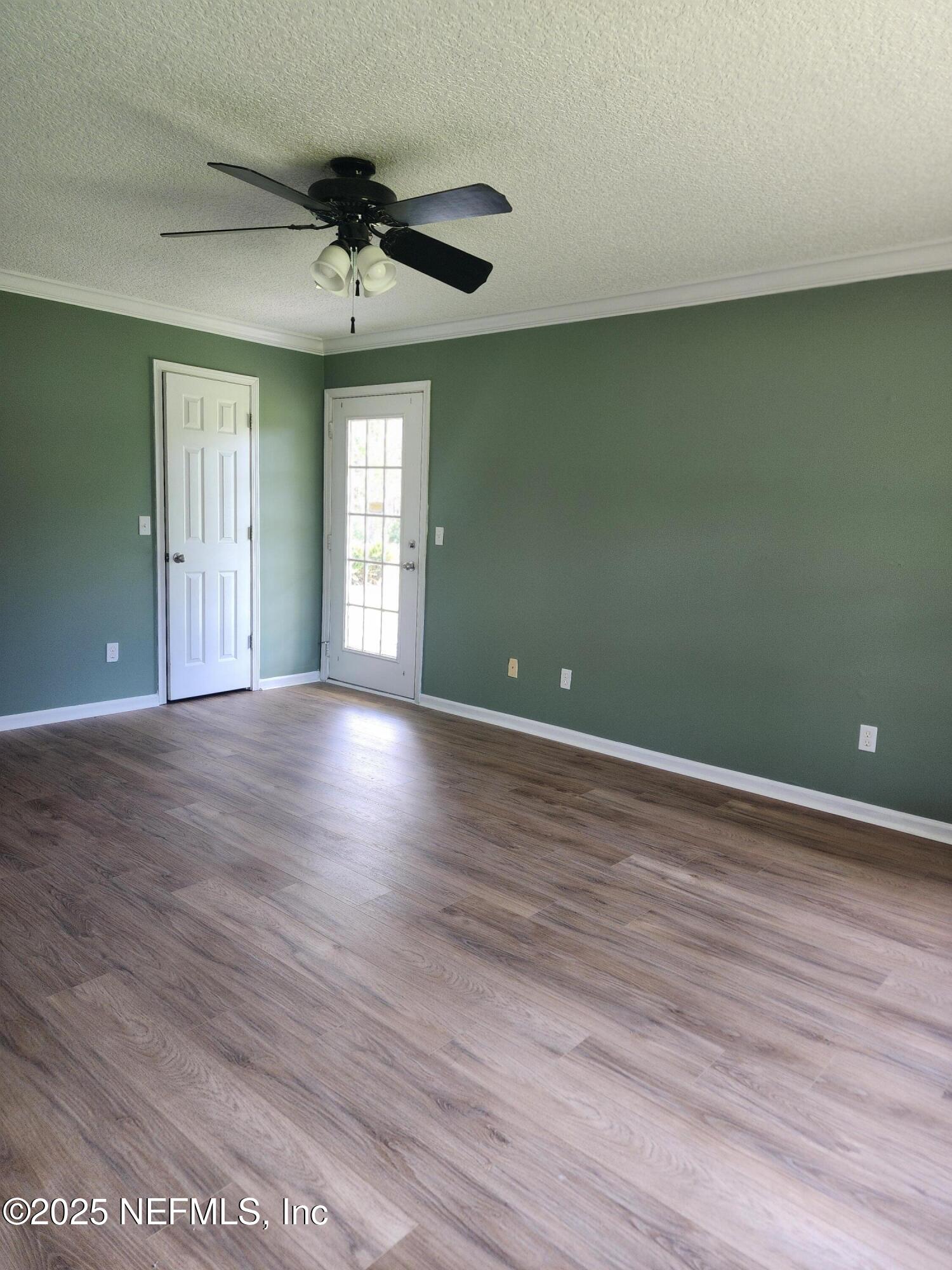 3794 Ron Road Green Cove Springs, FL 32043 - Photo 14 of 34 wooden floor in an empty room with a window