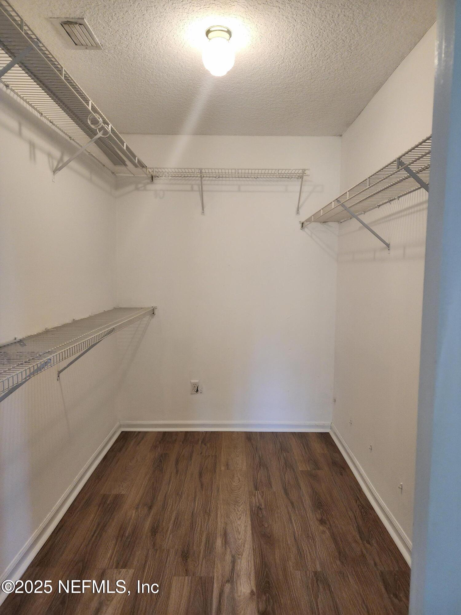 3794 Ron Road Green Cove Springs, FL 32043 - Photo 17 of 34 a view of a room with racks on the wall