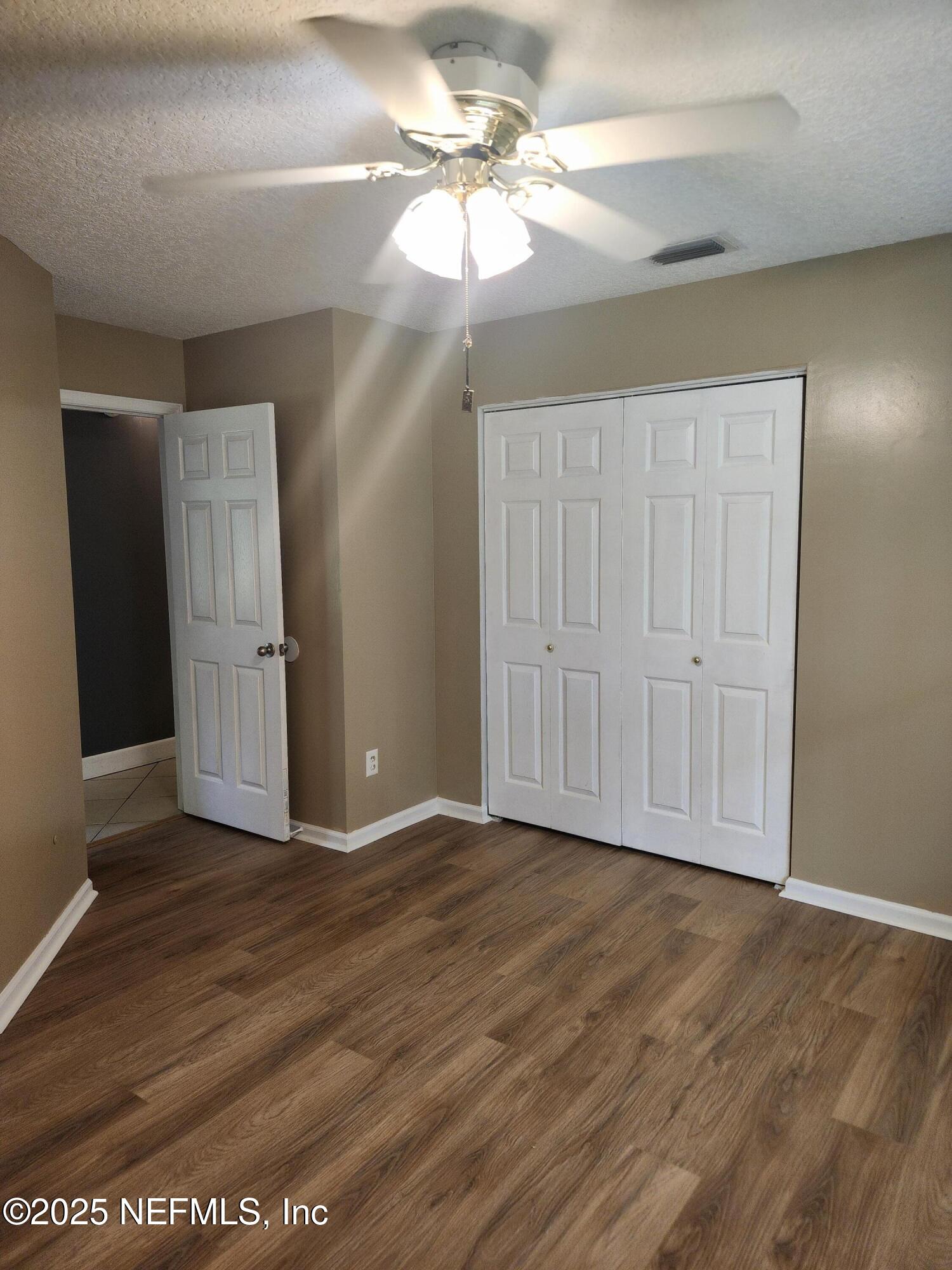 3794 Ron Road Green Cove Springs, FL 32043 - Photo 19 of 34 wooden floor in an empty room