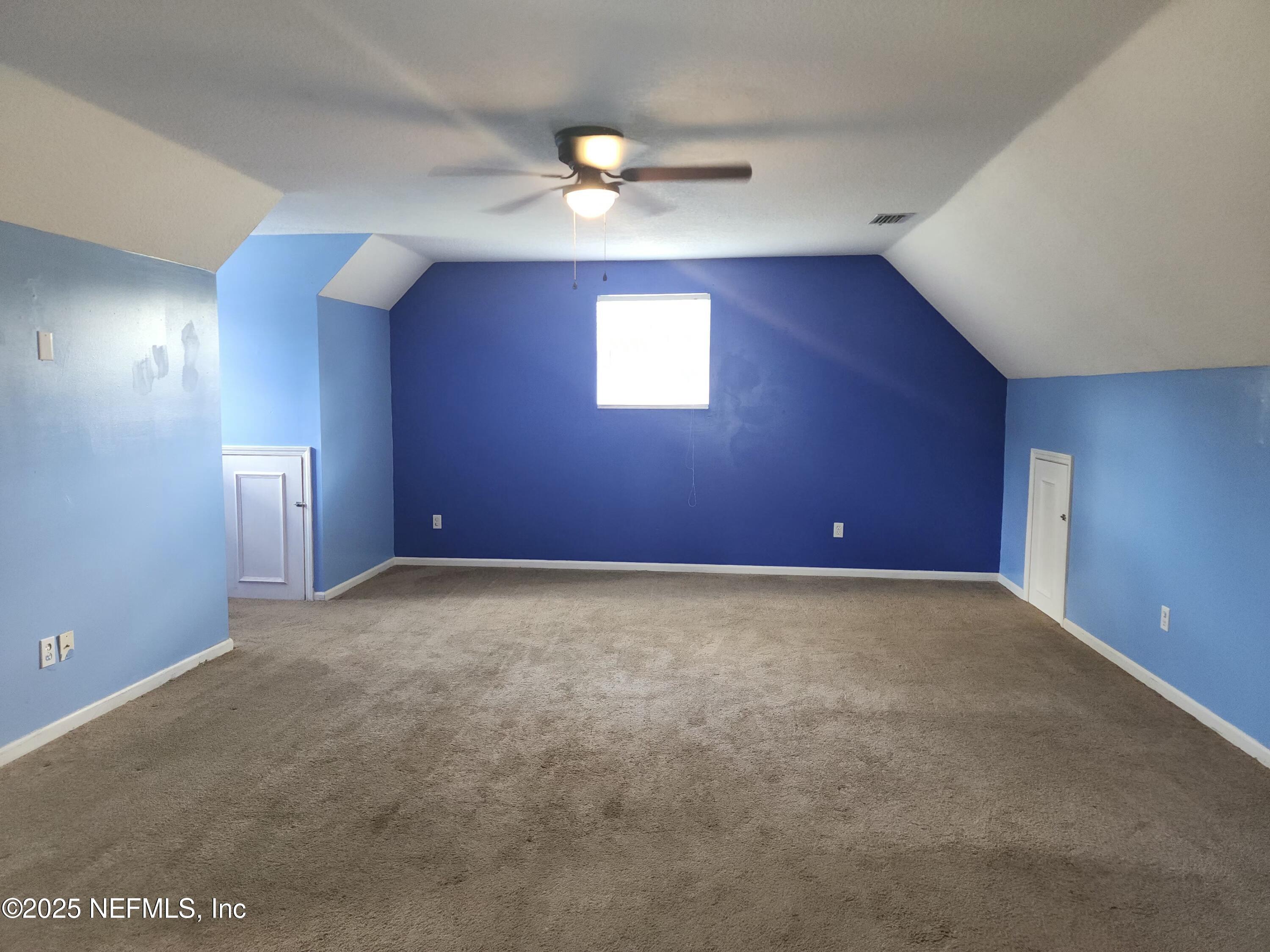 3794 Ron Road Green Cove Springs, FL 32043 - Photo 25 of 34 a view of an empty room with a window