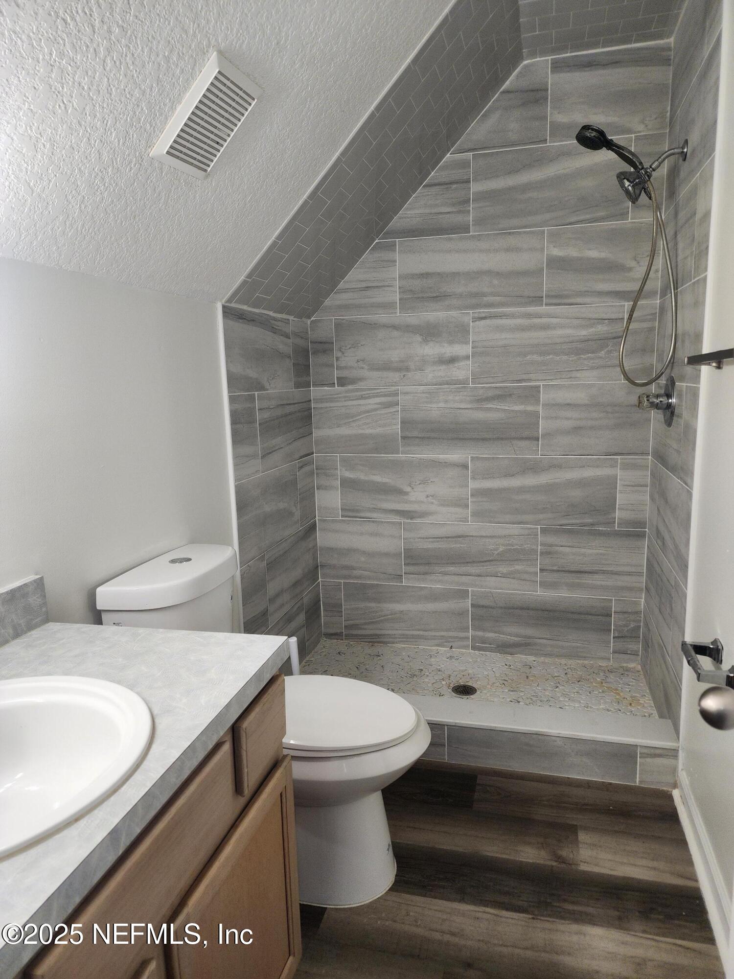 3794 Ron Road Green Cove Springs, FL 32043 - Photo 28 of 34 a bathroom with a toilet and a shower