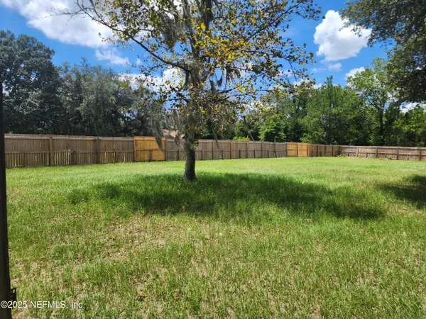 a view of swimming pool with a yard