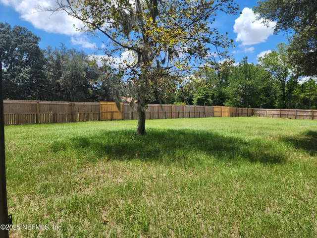 a view of swimming pool with a yard