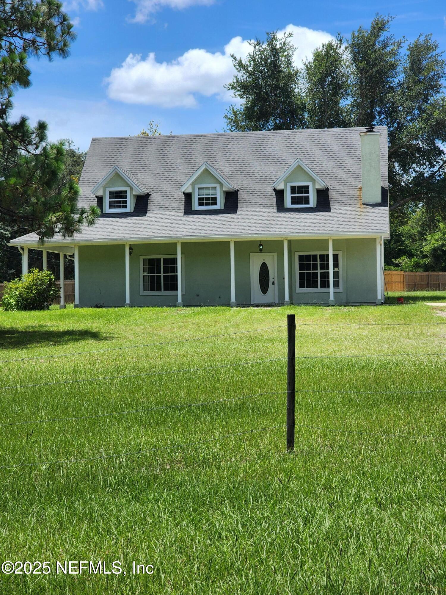 3794 Ron Road Green Cove Springs, FL 32043 - Photo 31 of 34 a view of a house with a backyard