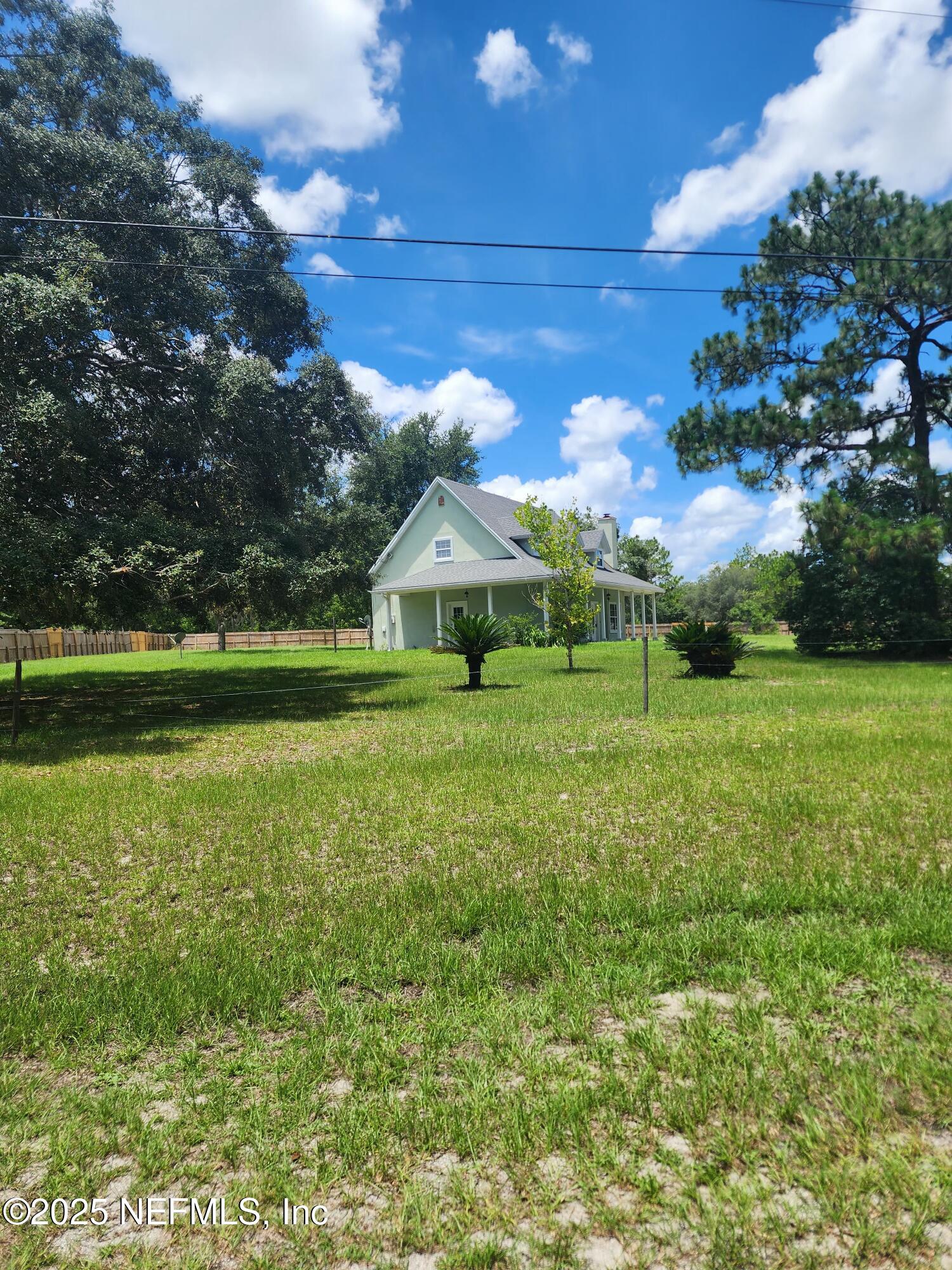 3794 Ron Road Green Cove Springs, FL 32043 - Photo 34 of 34 a backyard of a house with lots of green space
