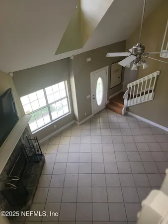 a view of an empty room and a window