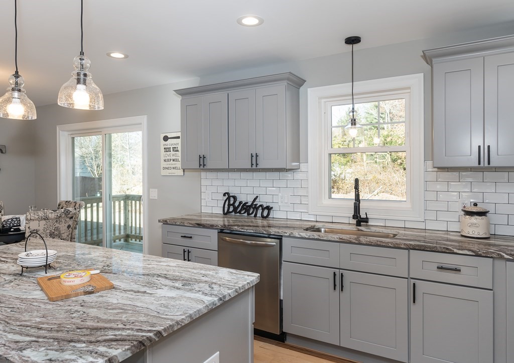 16 Cornflower Street Springfield, MA 01118 - Photo 11 of 36 a kitchen with a sink stove and window