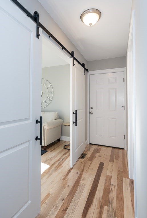 16 Cornflower Street Springfield, MA 01118 - Photo 15 of 36 a bedroom with a white bed and a white cabinet