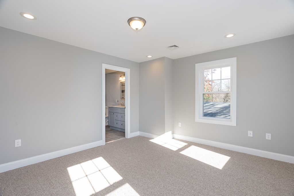 16 Cornflower Street Springfield, MA 01118 - Photo 24 of 36 a bedroom with a bed and a window