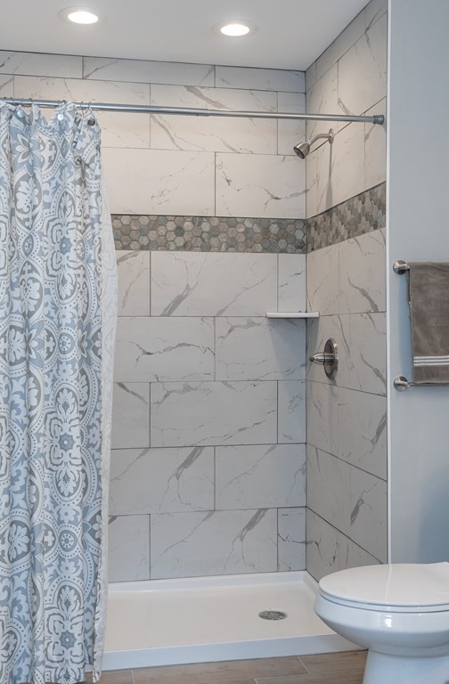 16 Cornflower Street Springfield, MA 01118 - Photo 26 of 36 a bathroom with a shower