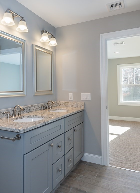 16 Cornflower Street Springfield, MA 01118 - Photo 27 of 36 a bathroom with a granite countertop sink mirror and