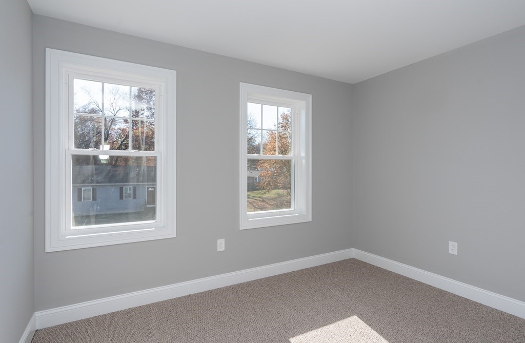 16 Cornflower Street Springfield, MA 01118 - Photo 28 of 36 a view of an empty room with a window