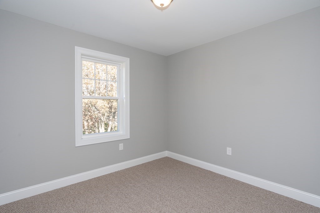16 Cornflower Street Springfield, MA 01118 - Photo 32 of 36 an empty room with a window