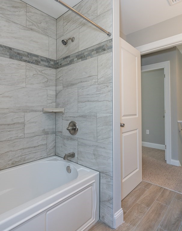 16 Cornflower Street Springfield, MA 01118 - Photo 35 of 36 a bathroom with a tub shower and vanity