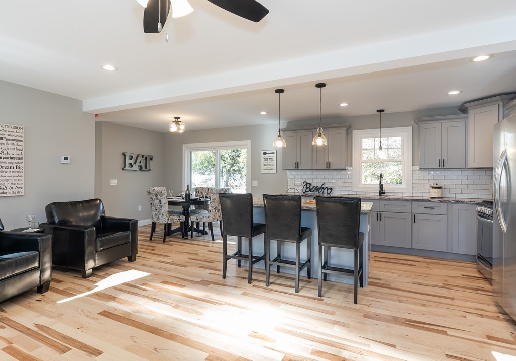 16 Cornflower Street Springfield, MA 01118 - Photo 10 of 36 a large kitchen with a table and chairs