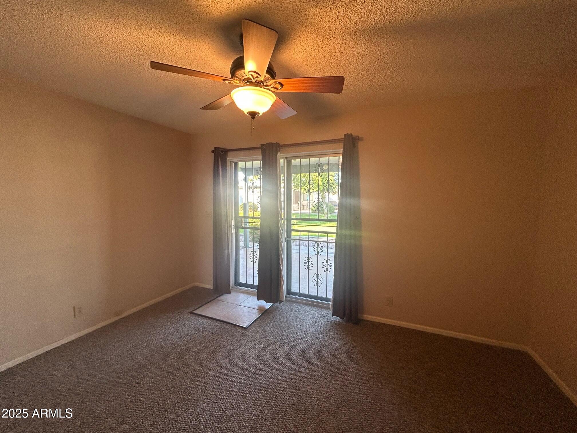 4328 East Capri Avenue, Unit 194 Mesa, AZ 85206 - Photo 10 of 13 a view of an empty room with a window