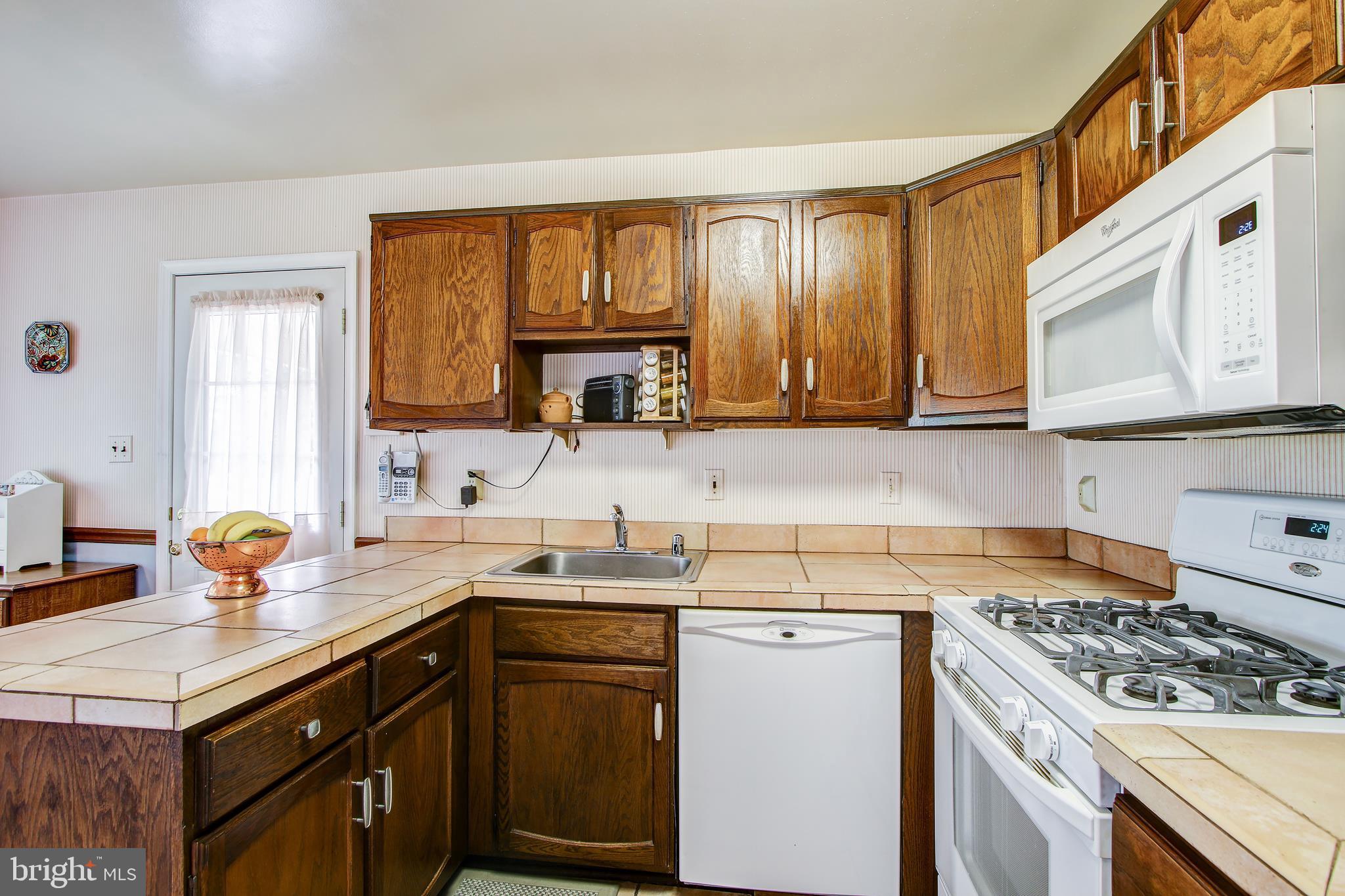 1708 Arbor View Road Silver Spring, MD 20902 - Photo 12 of 34 Open kitchen with tile countertop & floor