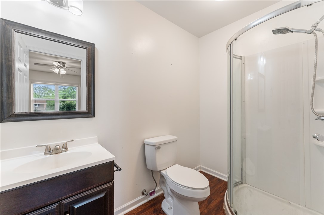 104 Leah Drive Pendleton, SC 29670 - Photo 15 of 23 This clean and functional bathroom features a shower, toilet, and vanity with a mirror.