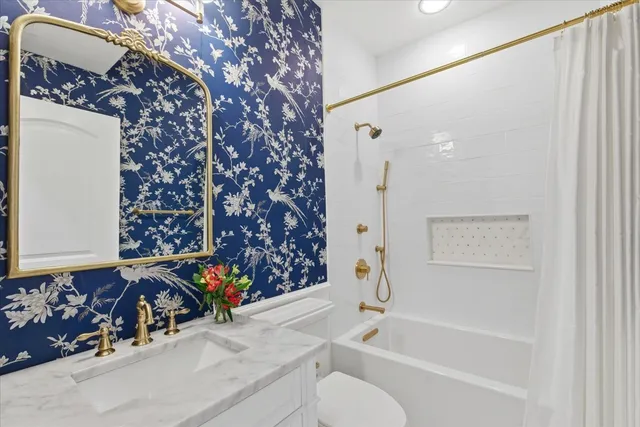 a bathroom with a bathtub and shower