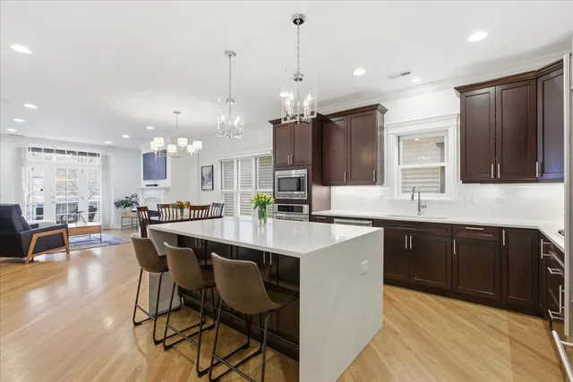 a large kitchen with a table and chairs