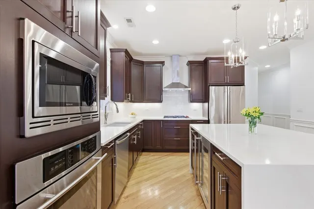 a kitchen with stove cabinets and refrigerator