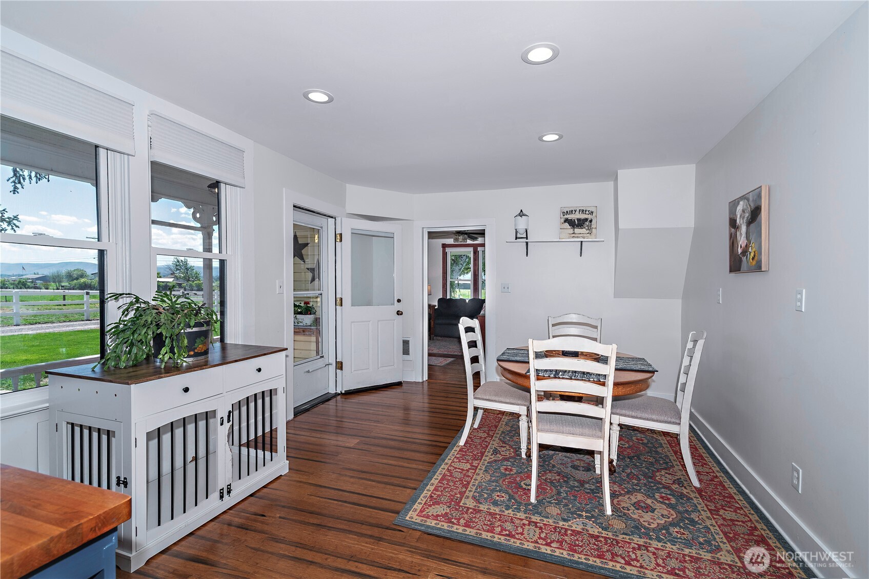 4441 Dry Creek Road Ellensburg, WA 98926 - Photo 14 of 32 a dining room with wooden floor and windows
