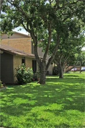 a view of a house with a garden