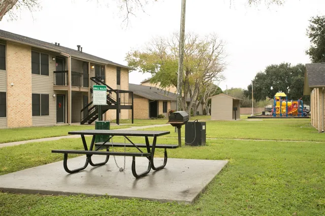 a view of a house with patio and a yard