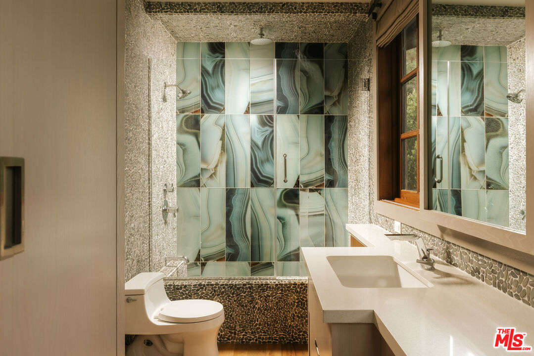 1105 Rivas Canyon Road Pacific Palisades, CA 90272 - Photo 39 of 49 a bathroom with a sink and toilet