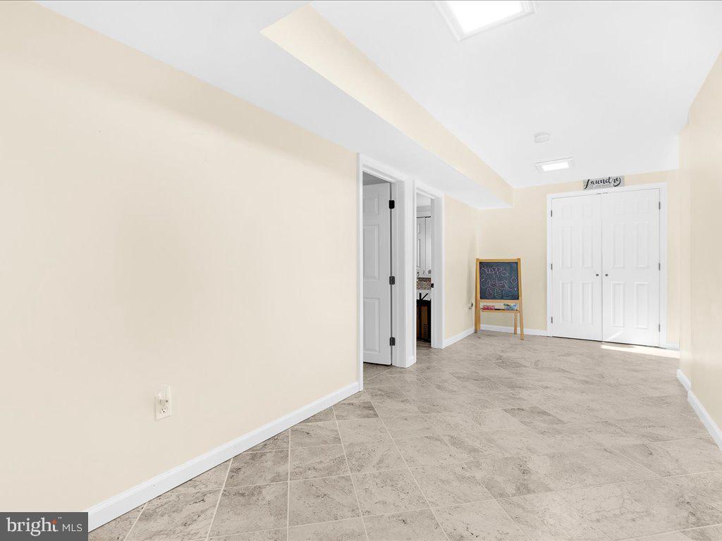 8195 Old Mill Road Pasadena, MD 21122 - Photo 38 of 51 Lower Level Hallway