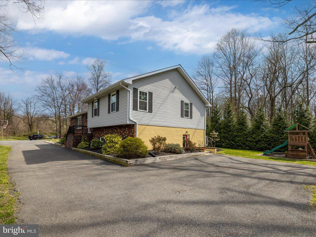 8195 Old Mill Road Pasadena, MD 21122 - Photo 49 of 51 Additional parking space on side of house!