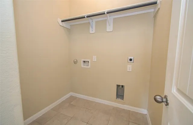 a white toilet sitting next to a white sink
