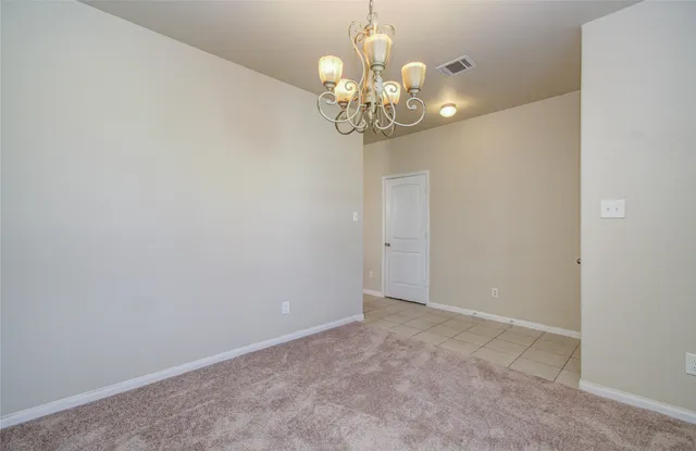 a kitchen with a stove sink and cabinets