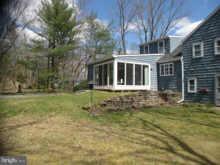 340 Jefferson Road Princeton, NJ 08540 - Photo 11 of 12 a front view of a house with a yard
