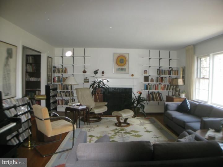 340 Jefferson Road Princeton, NJ 08540 - Photo 3 of 12 a living room with furniture and a fireplace
