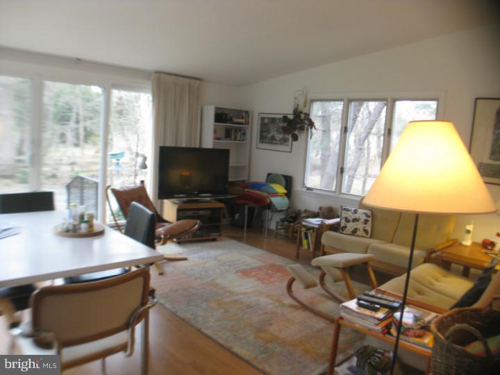 340 Jefferson Road Princeton, NJ 08540 - Photo 7 of 12 a living room with furniture and a flat screen tv